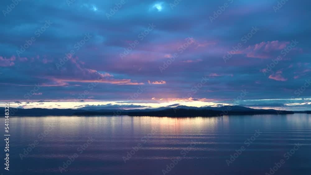 Beautiful cruise to Alaska. Beautiful canadian landscape, summer, sunset. North America. Sunset over the darkening mountains of the Inside Passage to Alaska. Beautiful cruise to Alaska. Beautiful canadian landscape, summer, sunset. North America. Sunset over the darkening mountains of the Inside Passage to Alaska.