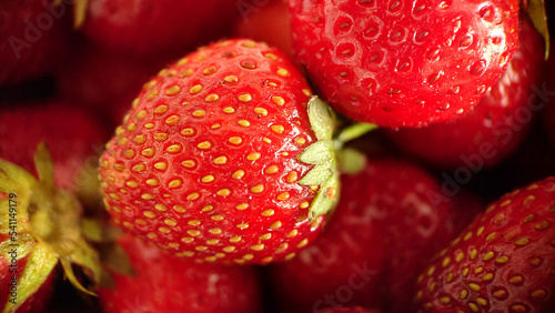 Juicy ripe strawberry berry selective focus close-up
