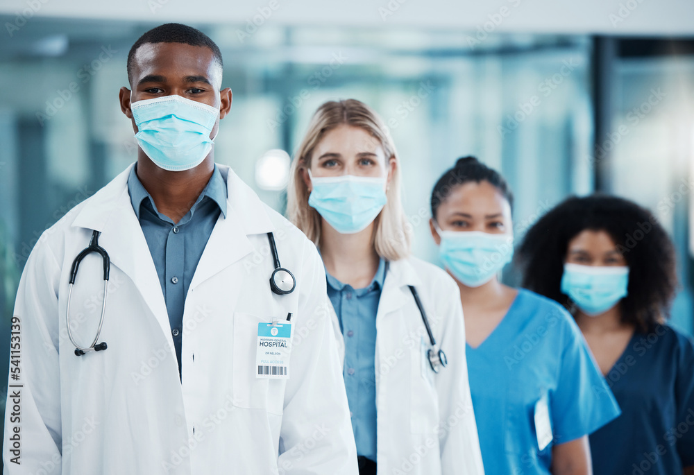 Covid, medical doctors and team working in healthcare, consulting and in collaboration together at a hospital. Group of medicine workers with face mask for safety from virus in a row at a clinic Covid, medical doctors and team working in healthcare, consulting and in collaboration together at a hospital. Group of medicine workers with face mask for safety from virus in a row at a clinic