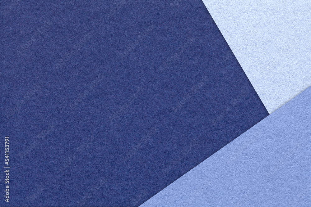 Texture of craft indigo color paper background with denim and very peri border. Vintage abstract navy blue cardboard. Texture of craft indigo color paper background with denim and very peri border. Vintage abstract navy blue cardboard.