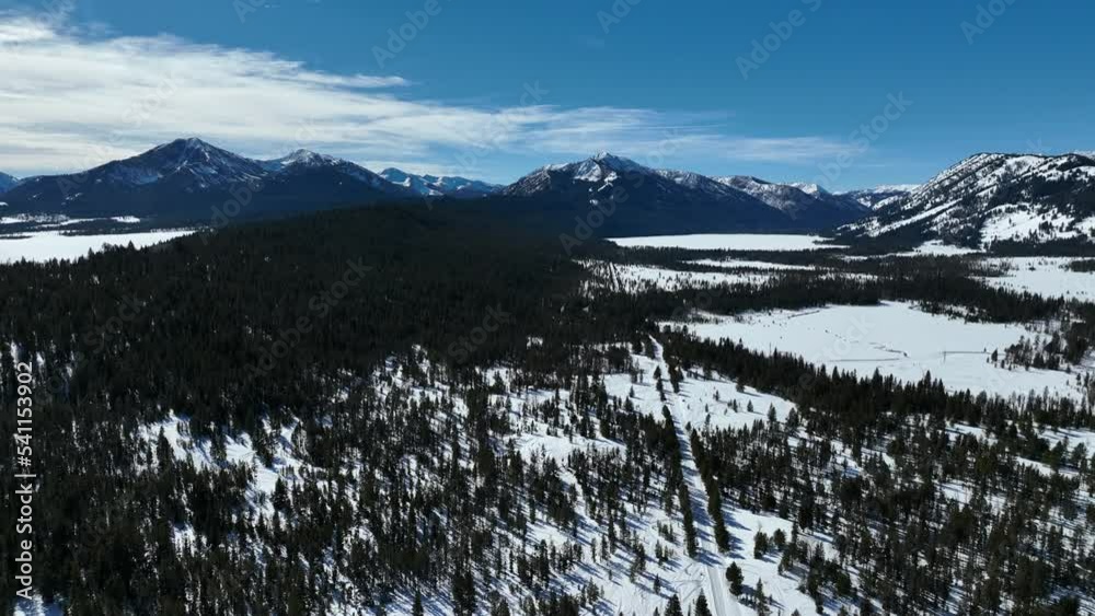 Coniferous Forest And Snow Mountains Near Sun Valley Ski Resort In Idaho. Aerial Wide Coniferous Forest And Snow Mountains Near Sun Valley Ski Resort In Idaho. Aerial Wide