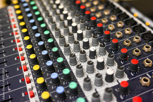 Sound Mixer in radio station. Close up of professional multitrack mixing console in production studio.  photo