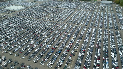 Many cars on a parking lot from above, filmed with a drone in 4k. high quality, thousand's of cars, Climate crisis, Co2, pollution photo