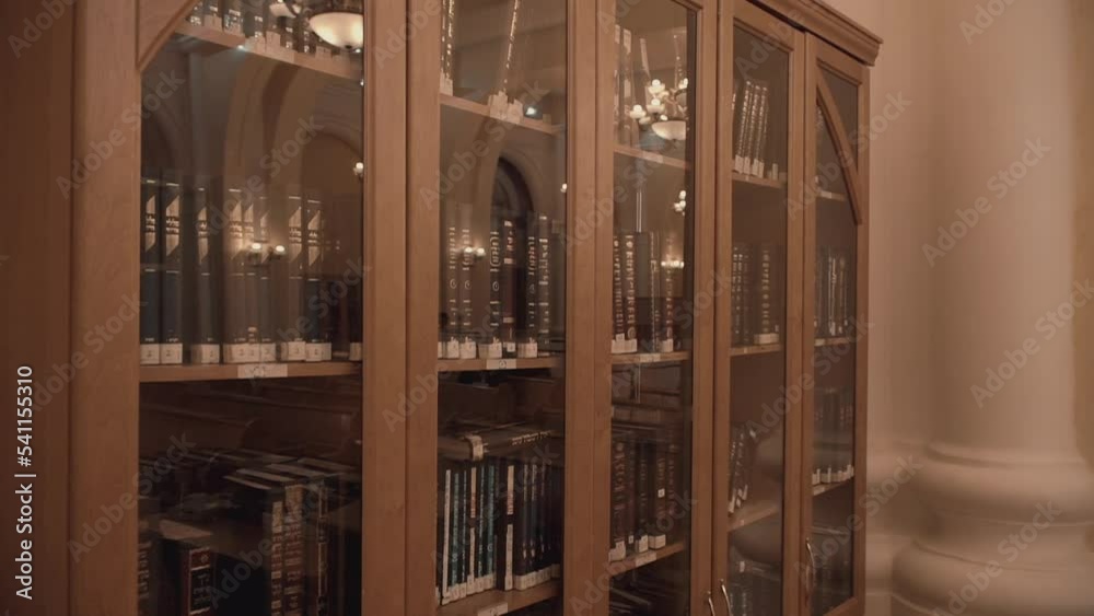 Modern Jewish library in Synagogue. Bookshelves with volumes ...