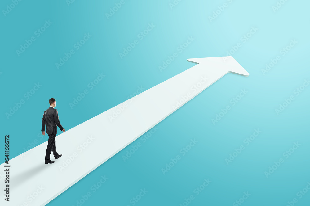 Side view of thoughtful young businessman on white arrow on blue background. Success, forward and up concept. Side view of thoughtful young businessman on white arrow on blue background. Success, forward and up concept.