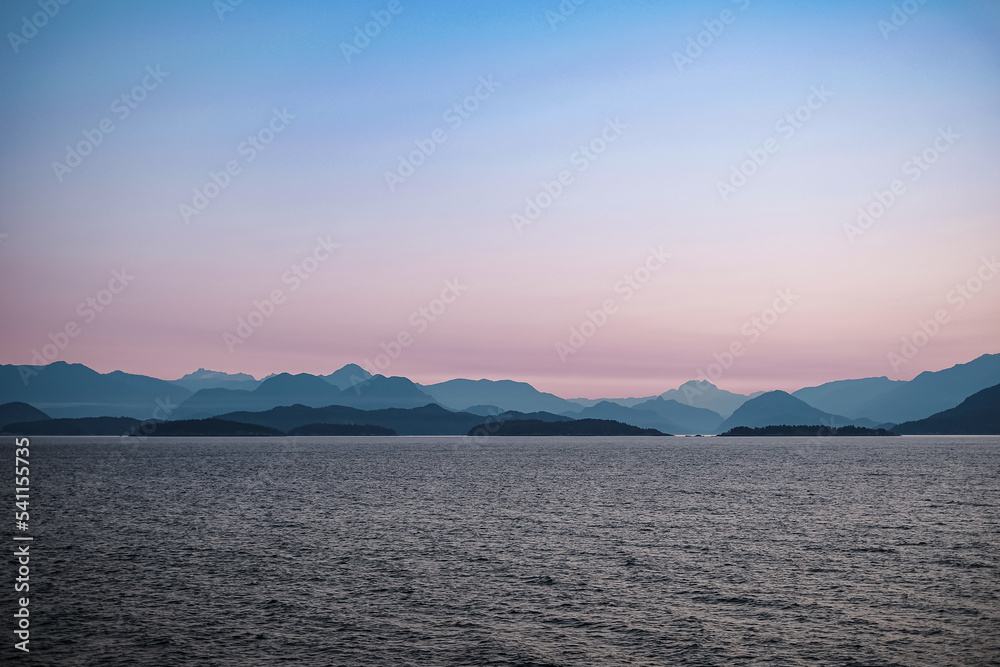 Early morning in the ocean and mountains near Vancouver Island. Beautiful sunrise. Dawn over the sea and mountains