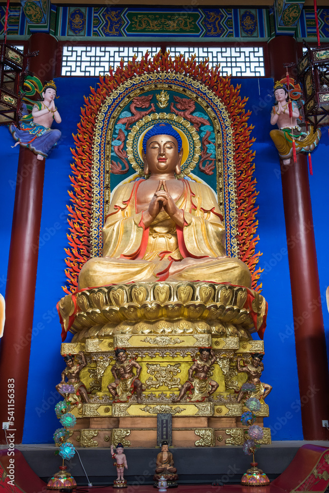 Buddha Sakyamuni statue and Buddhist deities in temple