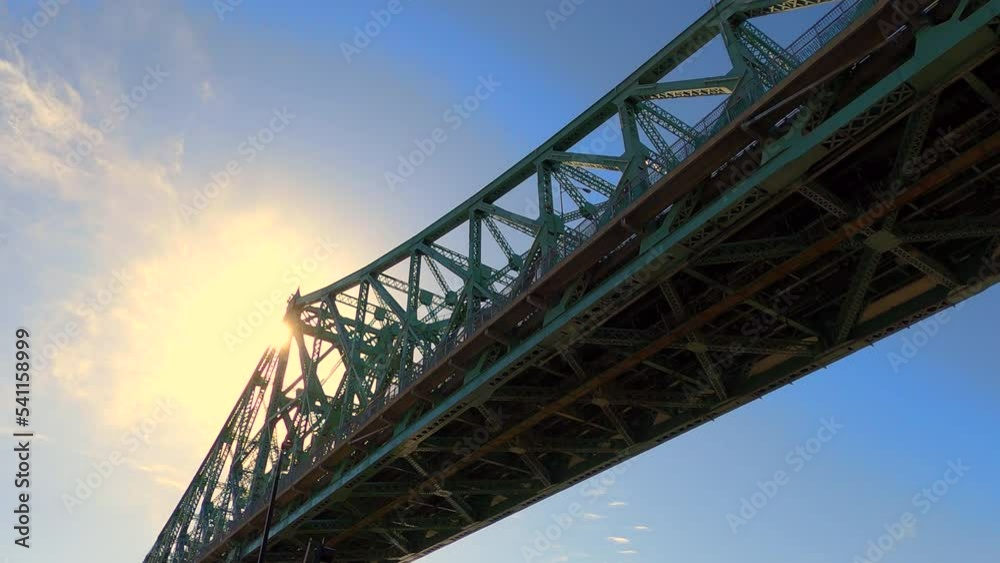 Low Angle View of Jacques Cartier Steel Bridge Montreal City Canada at Sunset, Urban Rigid Tall Metallic Elevated Structure for Transportation, Architectural Infrastructure and Engineering Low Angle View of Jacques Cartier Steel Bridge Montreal City Canada at Sunset, Urban Rigid Tall Metallic Elevated Structure for Transportation, Architectural Infrastructure and Engineering