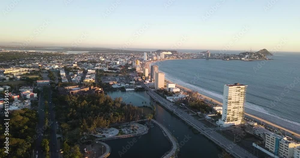 Aerial View of Seaside Coastal Touristic City, Waterfront Hotels and Buildings Along Malecon Beach Mexico. City Park and Cityscape in Horizon Aerial View of Seaside Coastal Touristic City, Waterfront Hotels and Buildings Along Malecon Beach Mexico. City Park and Cityscape in Horizon