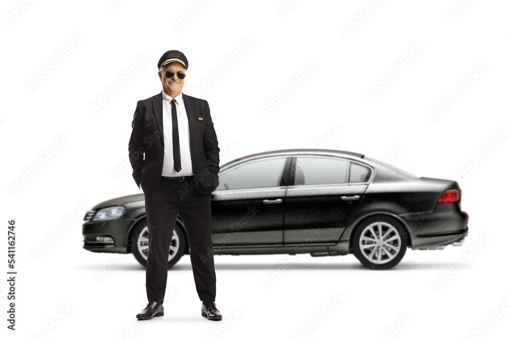 Full length portrait of a mature chauffeur posing in front of a black car Full length portrait of a mature chauffeur posing in front of a black car