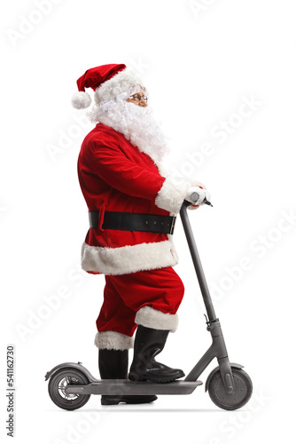 Full length profile shot of Santa Claus with an electric scooter