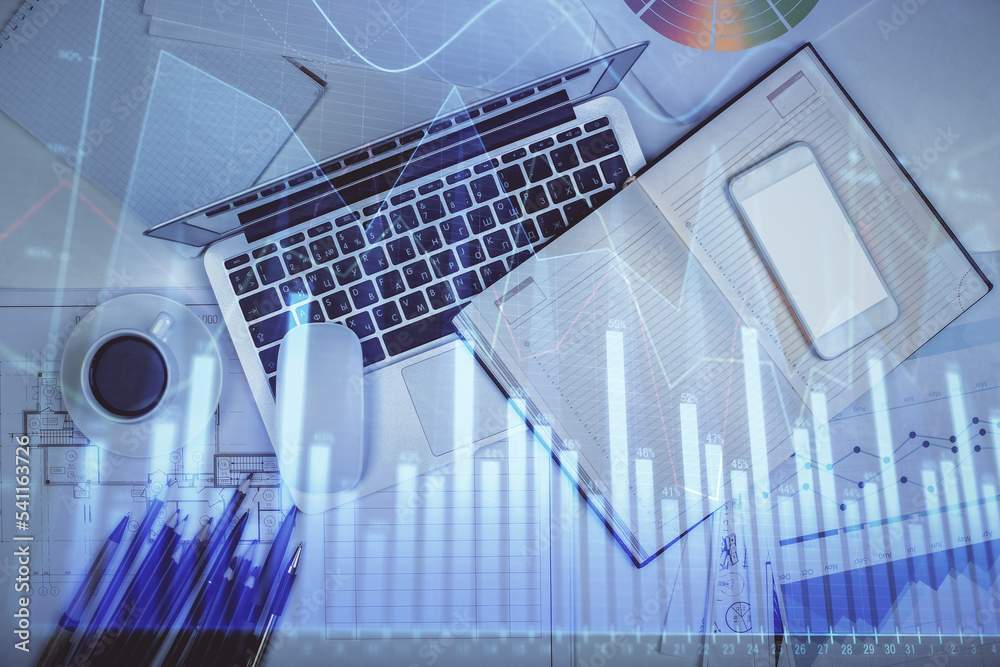 Multi exposure of forex chart drawing over table background with computer. Concept of financial research and analysis. Top view.