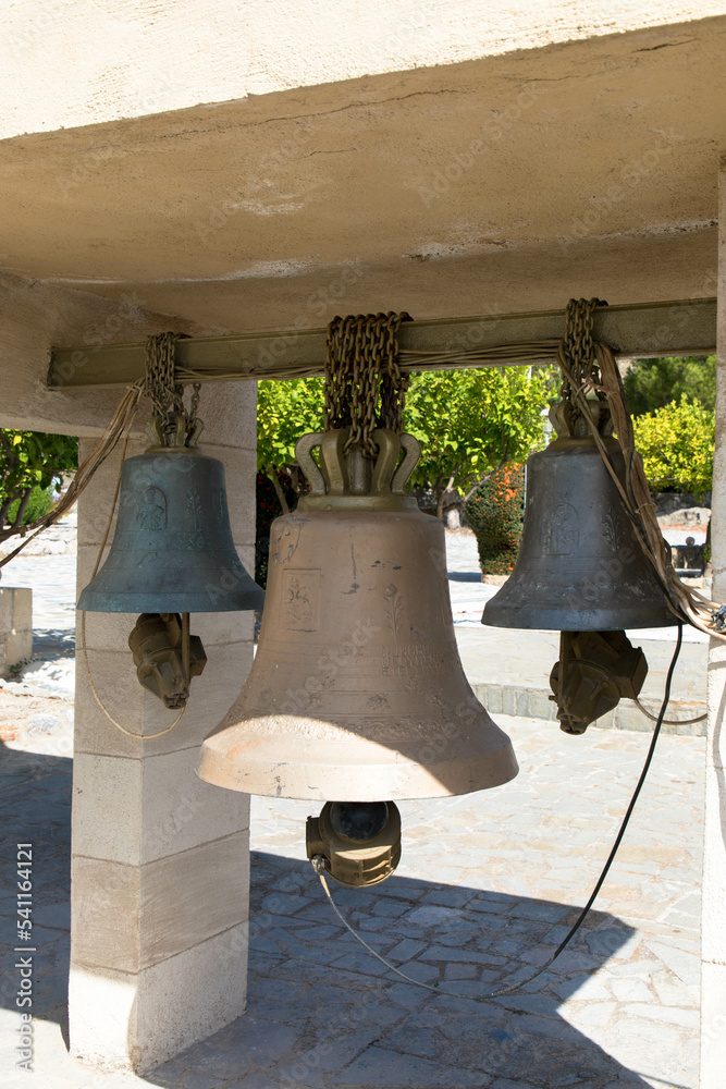 Bronce bells hangs in front of the Moni Thari monastery.
The monastery is one of the most important religious monuments on the island of Rhodes. Laerma, Rhodes, Dodecanese,