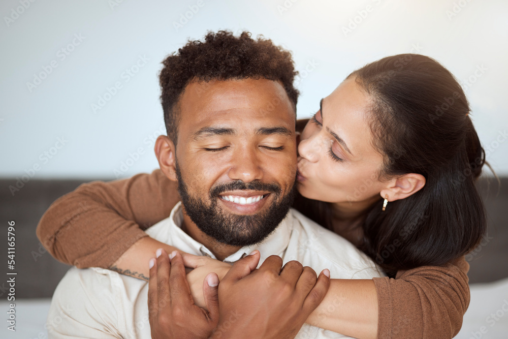 Love, black couple and kiss with hug, being happy and embrace together