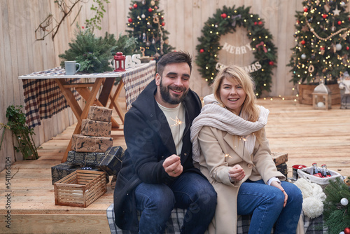 Winter holidays and celebrations. Christmas couple in love near Christmas tree outdoors © Aleksandr