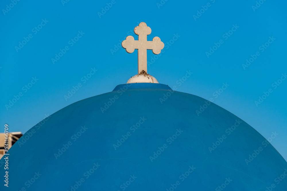 Blue-domed Green Orthodox church at Oia town on Santorini island Blue-domed Green Orthodox church at Oia town on Santorini island