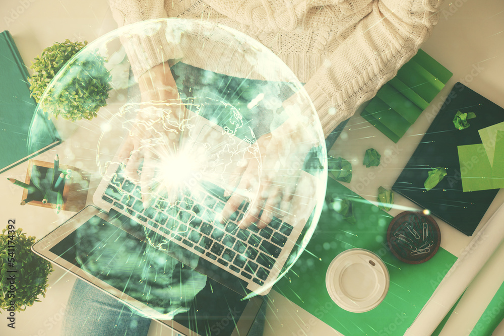 Double exposure of woman hands working on computer and financial theme hologram drawing. Top View. Business concept. Double exposure of woman hands working on computer and financial theme hologram drawing. Top View. Business concept.