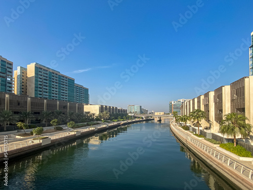 The canal and buildings in the Al Raha Beach neighbourhood in Abu Dhabi. Al Raha Beach is a mixed-use development with waterfront apartments. photo