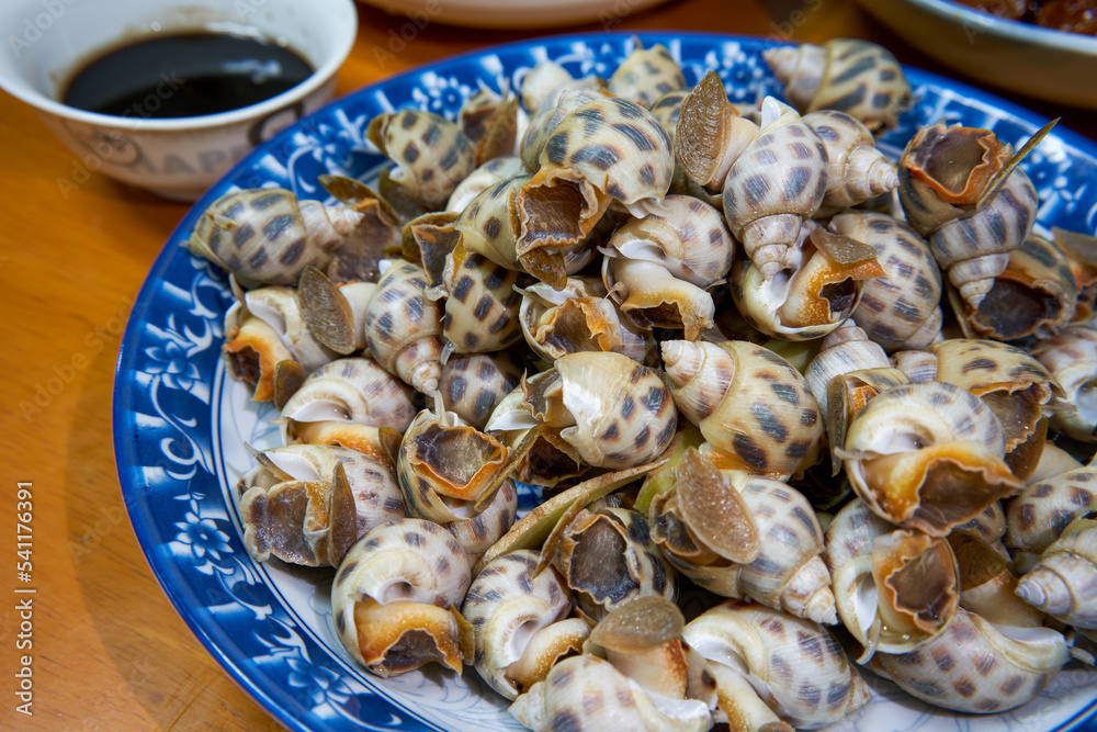 A plate of sweet and delicious boiled snails A plate of sweet and delicious boiled snails