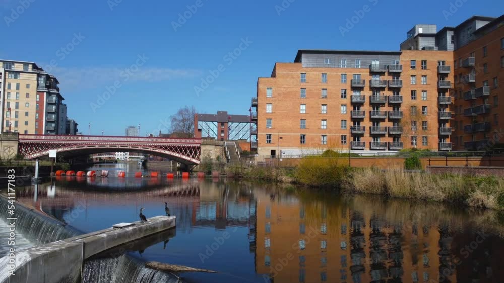 Slow low aerial drone shot flying over River Aire weir with 2 birds in Leeds City Centre Yorkshire UK Slow low aerial drone shot flying over River Aire weir with 2 birds in Leeds City Centre Yorkshire UK