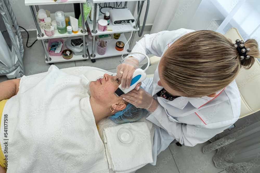 cosmetologist who performs darsonvalization of the skin of the face skin and body cosmetologist who performs darsonvalization of the skin of the face skin and body
