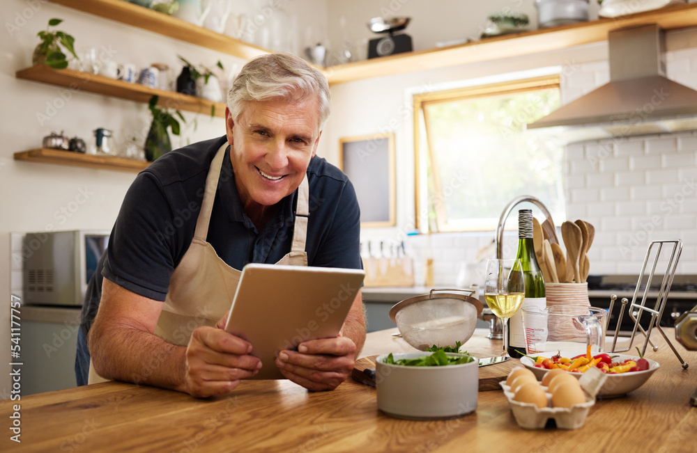 Senior man portrait, cooking and tablet of a elderly person in a kitchen ready for morning breakfast. Online recipe, technology and web scroll at home with internet and technology to cook home food Senior man portrait, cooking and tablet of a elderly person in a kitchen ready for morning breakfast. Online recipe, technology and web scroll at home with internet and technology to cook home food
