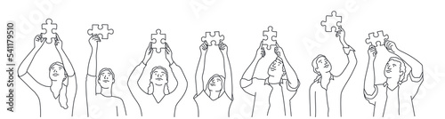 People holding a jigsaw puzzle piece which joins another puzzle piece.