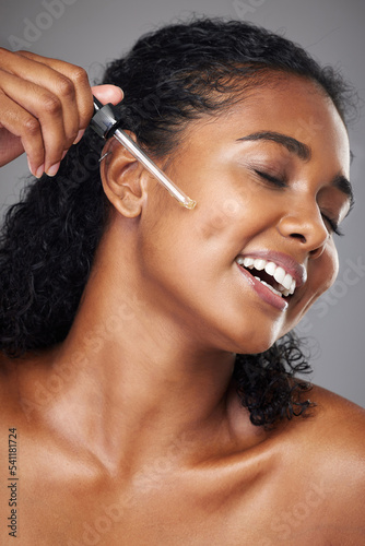 Obraz na plátně Black woman, face moisturizer and oil serum, beauty and skincare, natural cosmetics ad in studio background