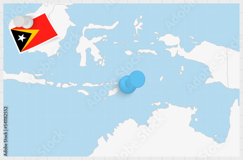 Map of East Timor with a pinned blue pin. Pinned flag of East Timor. photo