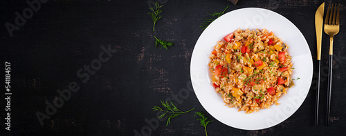 Tomato rice with vegetables and chicken. Healthy food. Healthy lifestyle. Top view, banner