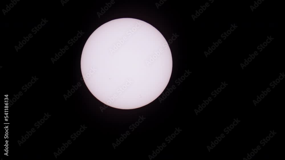 Sun with sunspots and birds flying over clean black background Sun with sunspots and birds flying over clean black background