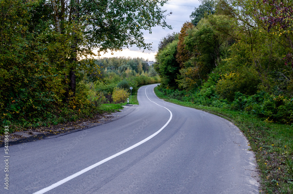 Asphalt road from the hill in the countryside.