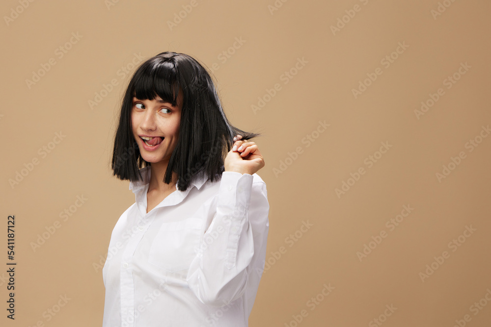Pretty sexy beautiful stylish adorable brunet lady in white shirt posing isolated on pastel beige studio background. Copy space Banner Offer. Pulp Fiction concept. Fashion Cinema Pretty sexy beautiful stylish adorable brunet lady in white shirt posing isolated on pastel beige studio background. Copy space Banner Offer. Pulp Fiction concept. Fashion Cinema
