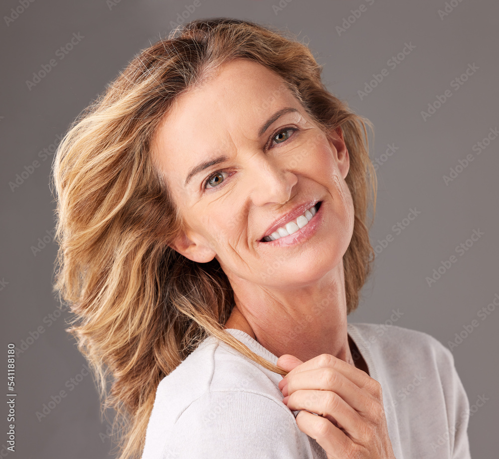 Fototapeta premium Skincare, anti aging and beautiful mature woman with a smile on her face on gray background. Beauty, fashion and skin care, middle aged lady from USA with health, wellness and wrinkles on clean skin.