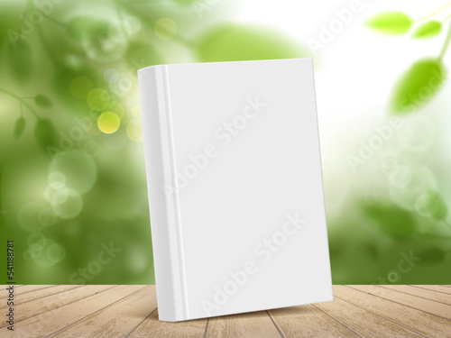 Mockup book with white cover on a wooden table.