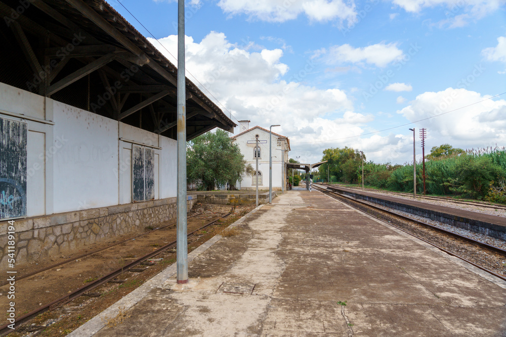 remote railway siding showing platform and train tracks