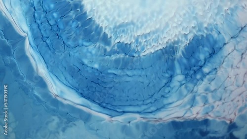  Flowing glitter waving surface. Beautiful metallic pink, purple, lilac texture paint close-up. Liquid slow motion Art. Colorful Chaos Turbulence.