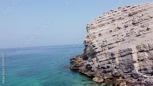 Drone shot of rocky mountain beach in Oman photo