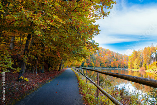 Road along the Vltava river in the autumn season.