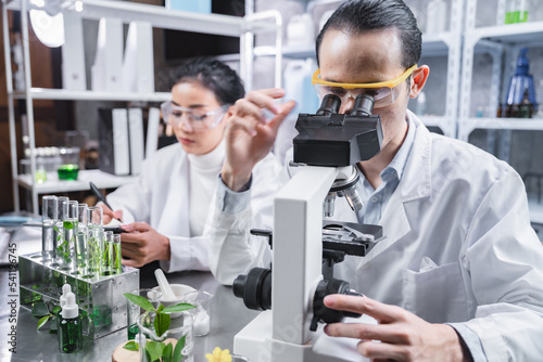 pharmaceutical science laboratory of health care cosmetic research, apothecary scientist working to test a organic herb drug of chemical medicine experiment with chemist doctor, beaker glasses tools