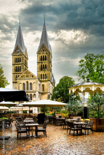 The Munsterkerk (Munsterk Church) with pavilion, chairs and tables in foreground in the city of Roermond, Netherlands