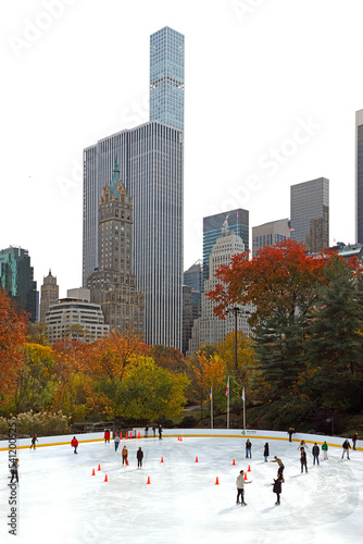 Wollman, ice skating rink in Central Park against background of New York skyscrapers on picturesque autumn © valeriyap