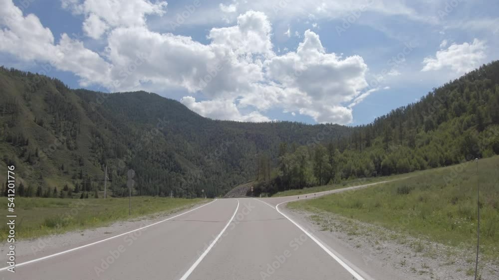 Video of driving in a car In summer season along the mountain road in Altai. Video of driving in a car In summer season along the mountain road in Altai.
