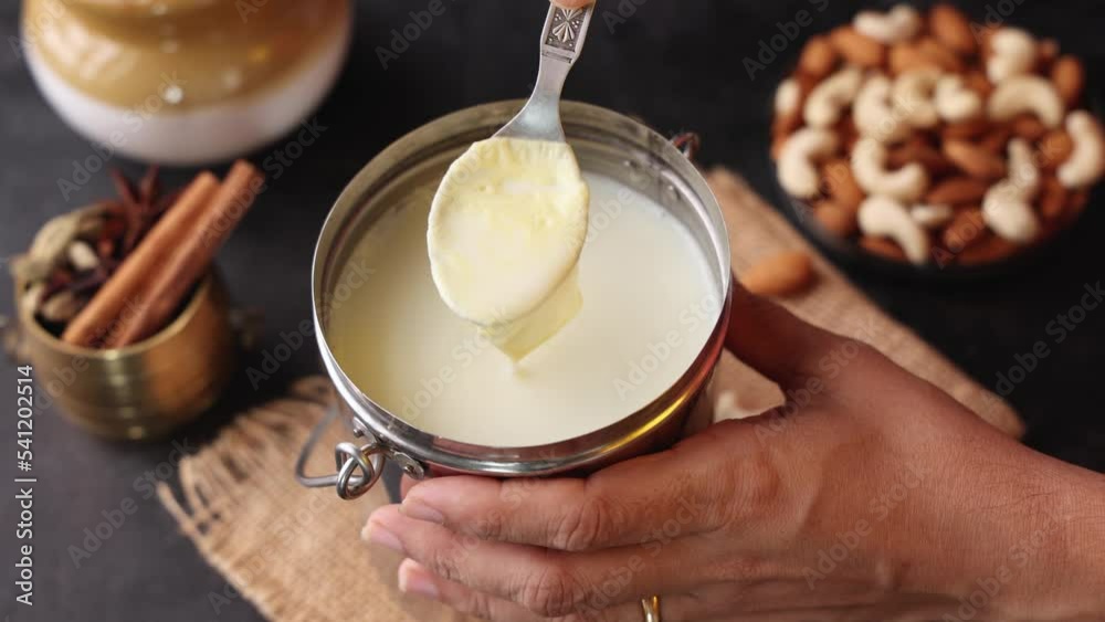 White thick layer of form over milk. Separate thick cream from milk