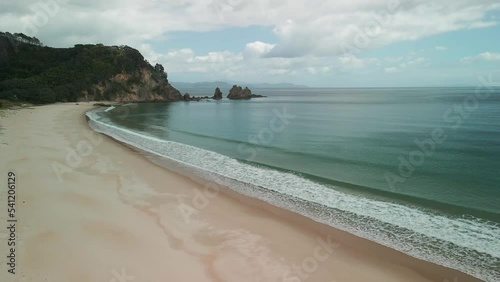 Reflections of low tide along an isolated beach photo