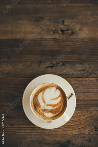 Fotobehang White cup with fresh cappuccino on wooden background