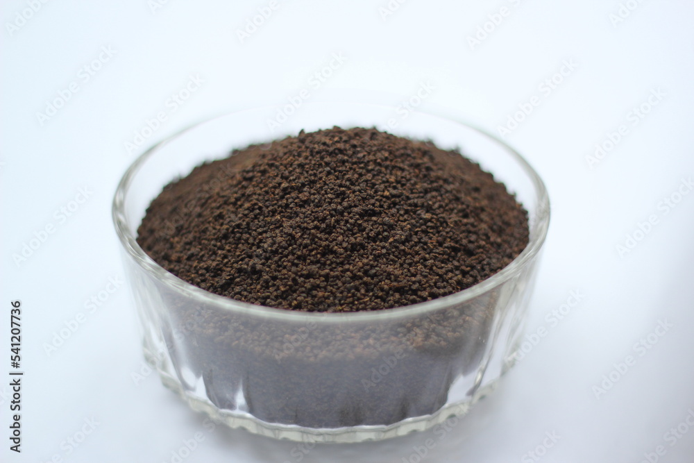 Dry black tea leaves decorated on white background Dry black tea leaves decorated on white background