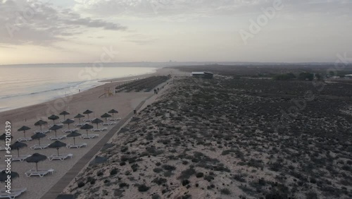 Aerial panoramic sunset seascape view of Salgados beach in Albufeira, at Algarve region, a Worldwide Popular Beach and Nature Destination, in South Portugal.