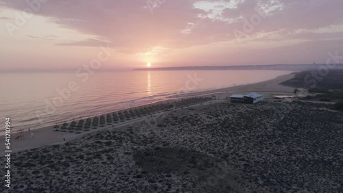 Aerial panoramic sunset seascape view of Salgados beach in Albufeira, at Algarve region, a Worldwide Popular Beach and Nature Destination, in South Portugal.