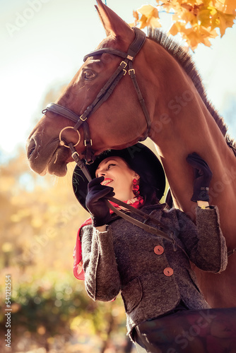 Girl in a hat on a horse